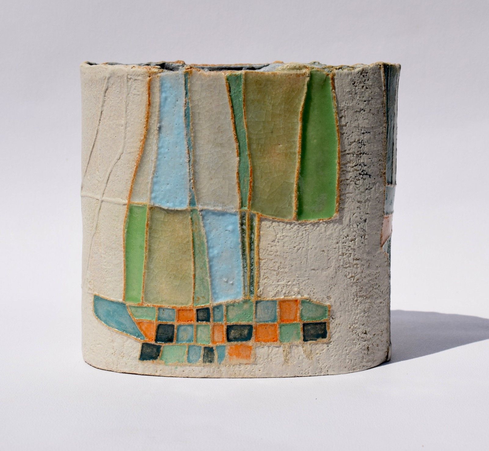 A ceramic sculpture with a geometric design on it