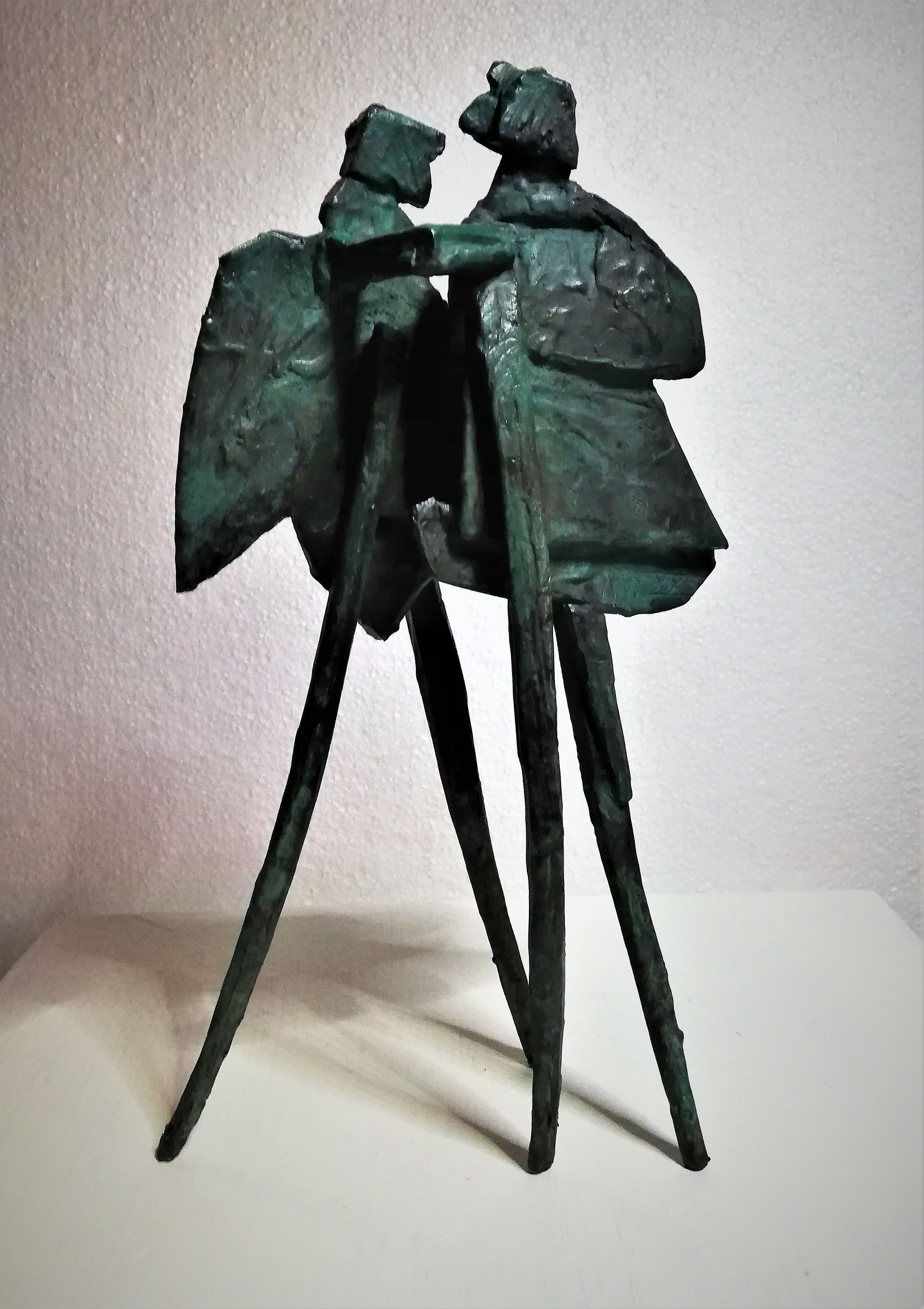 A statue of two people standing next to each other