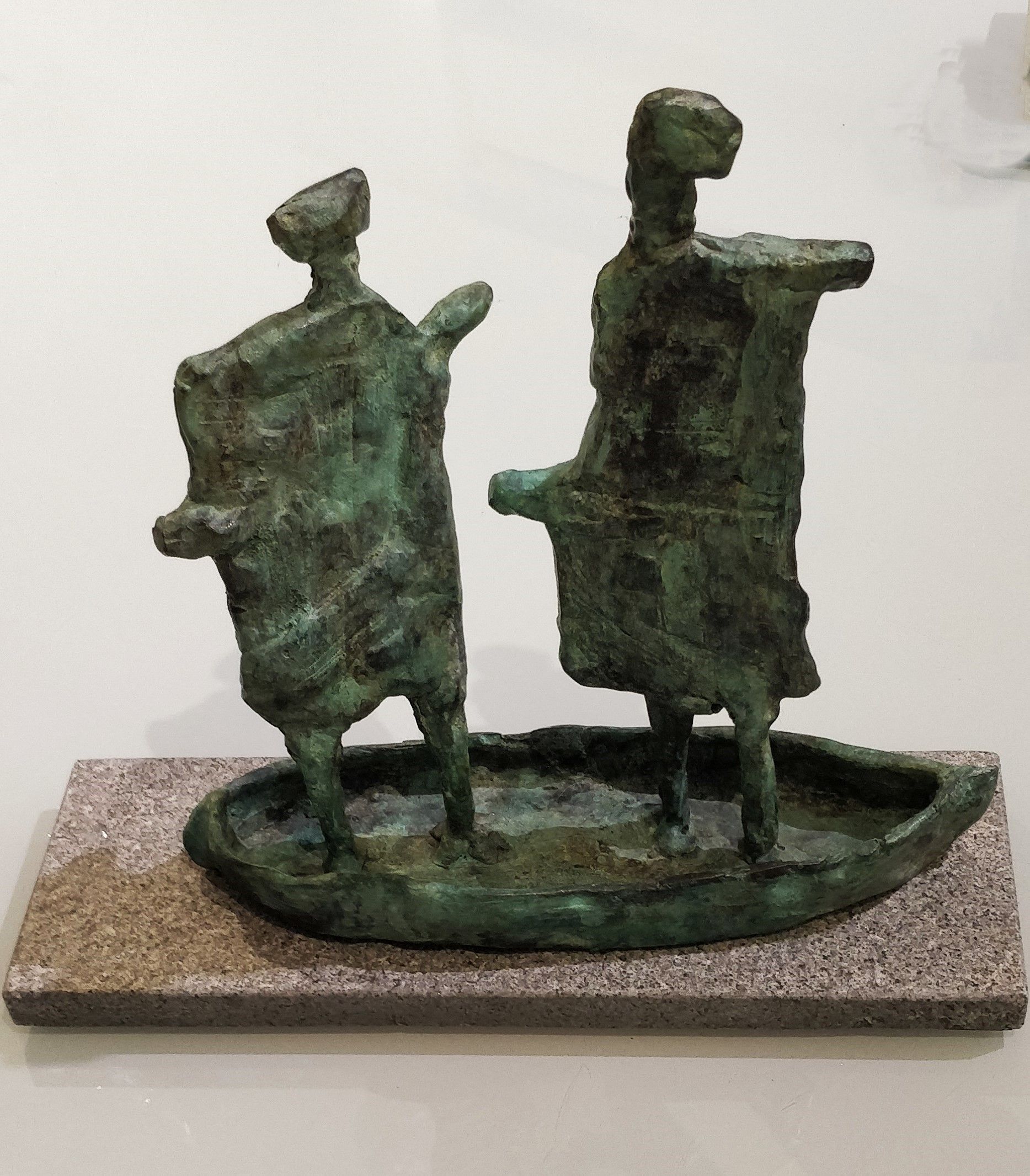 A statue of two people standing next to each other