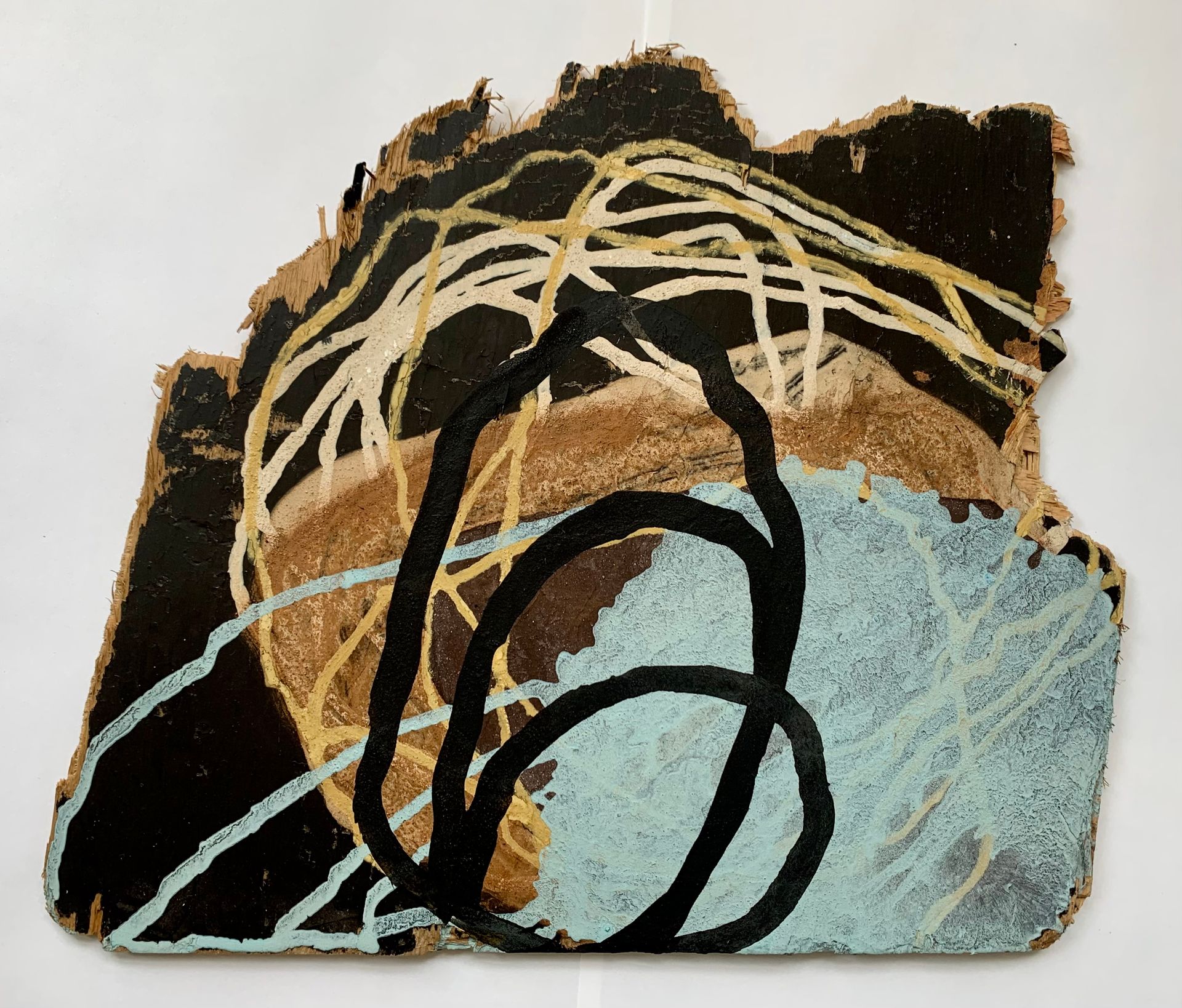 Abstract art with black, tan, and pale blue paint and looping white lines on a textured surface