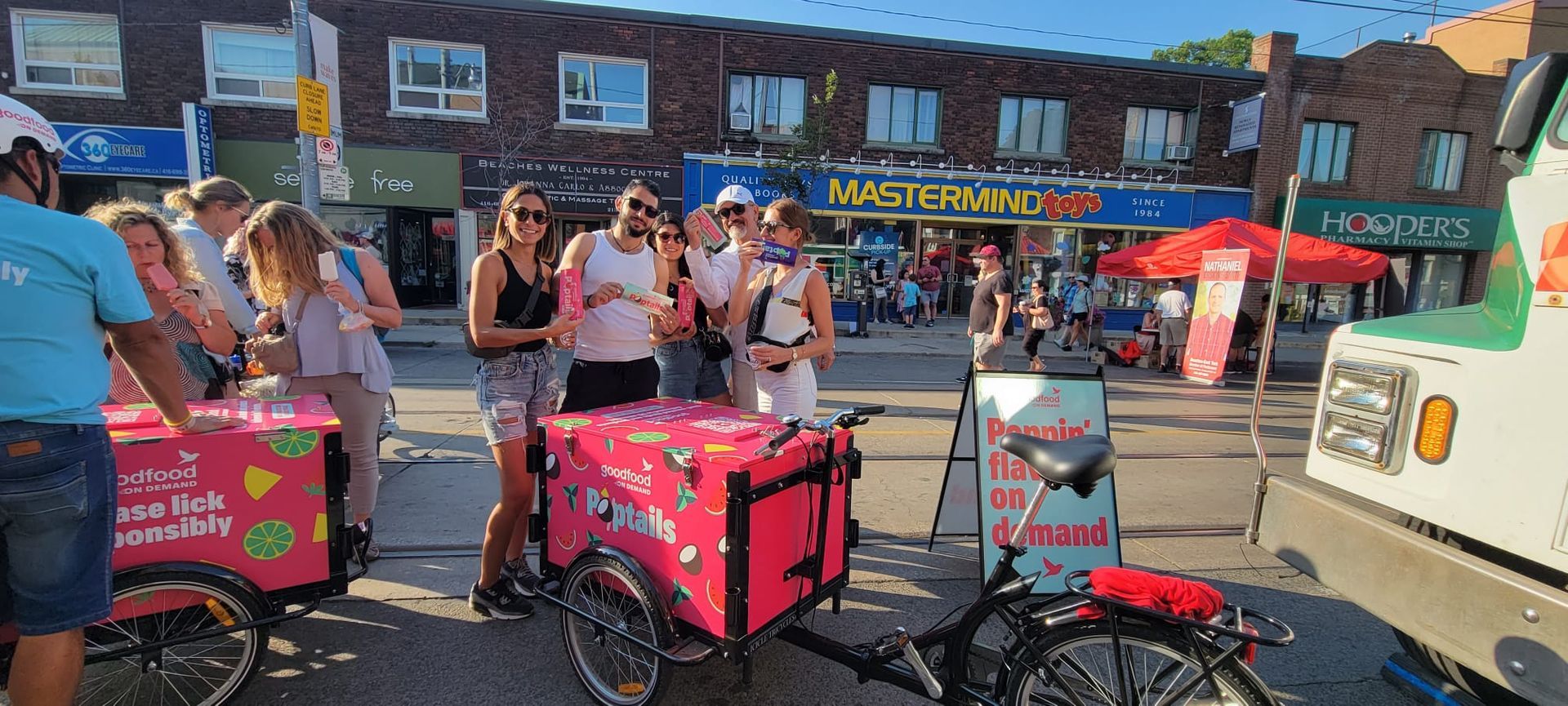 A group of people are standing around a bicycle.