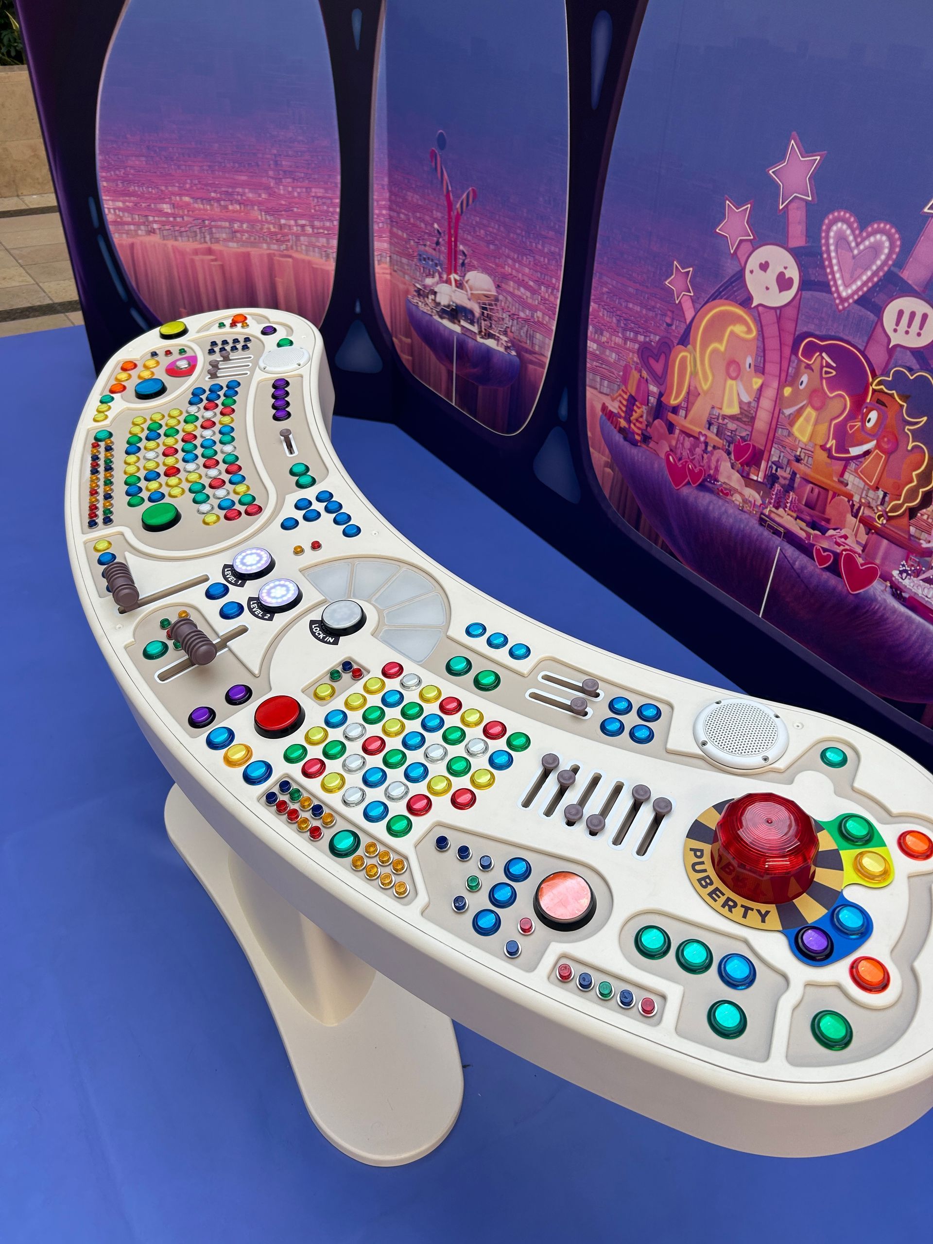 A white table with a lot of buttons on it