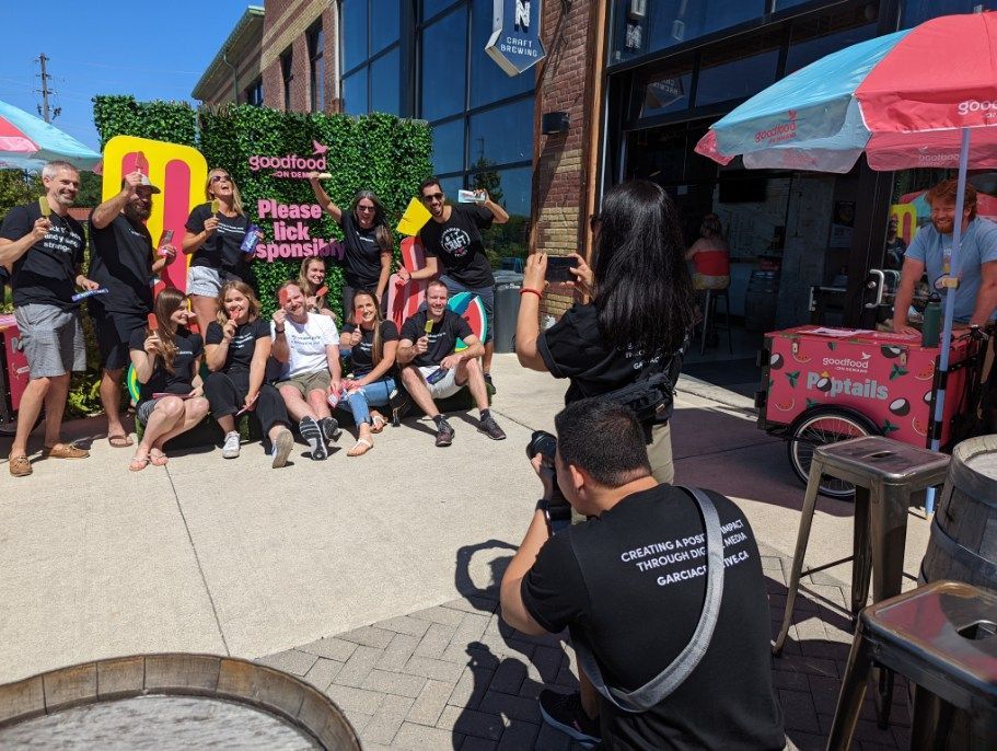 A group of people are posing for a picture in front of a building.