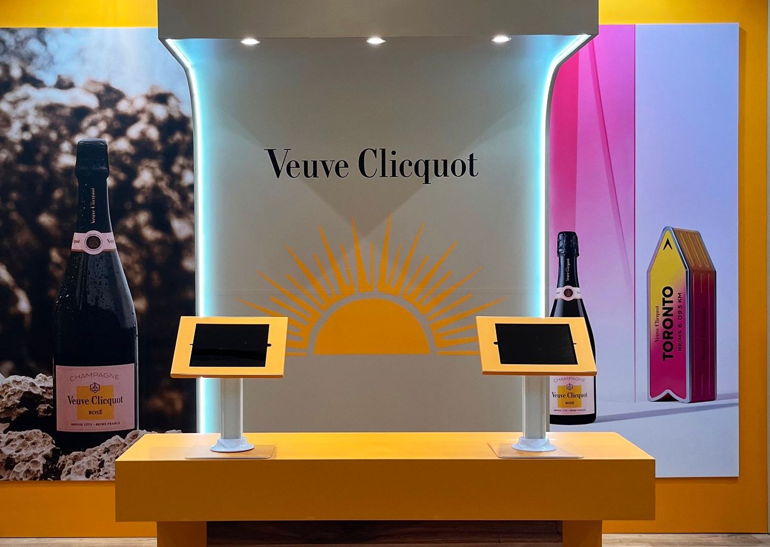 A display of veuve clicquot champagne with two tablets