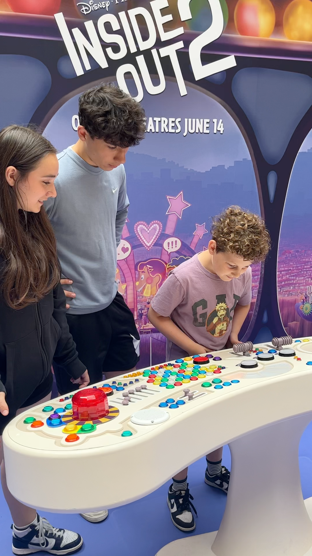A group of children are playing a game at a table.