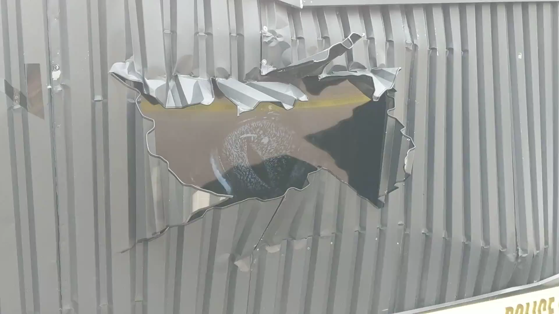 There is a hole in the wall of a building.