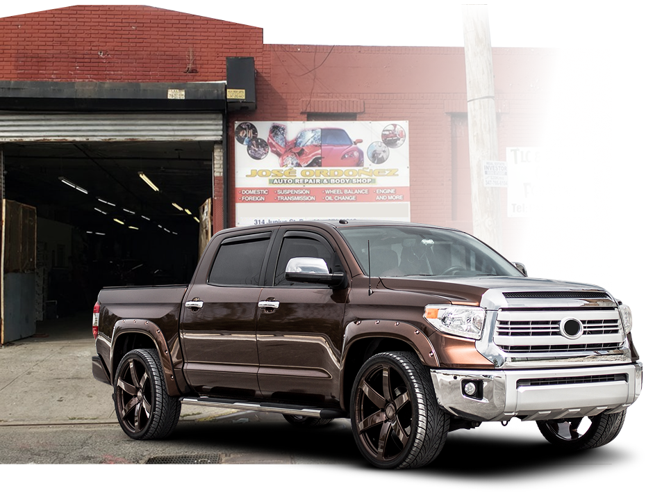A brown truck is parked in front of a building | Jose Ordonez Auto Repair and Body Shop