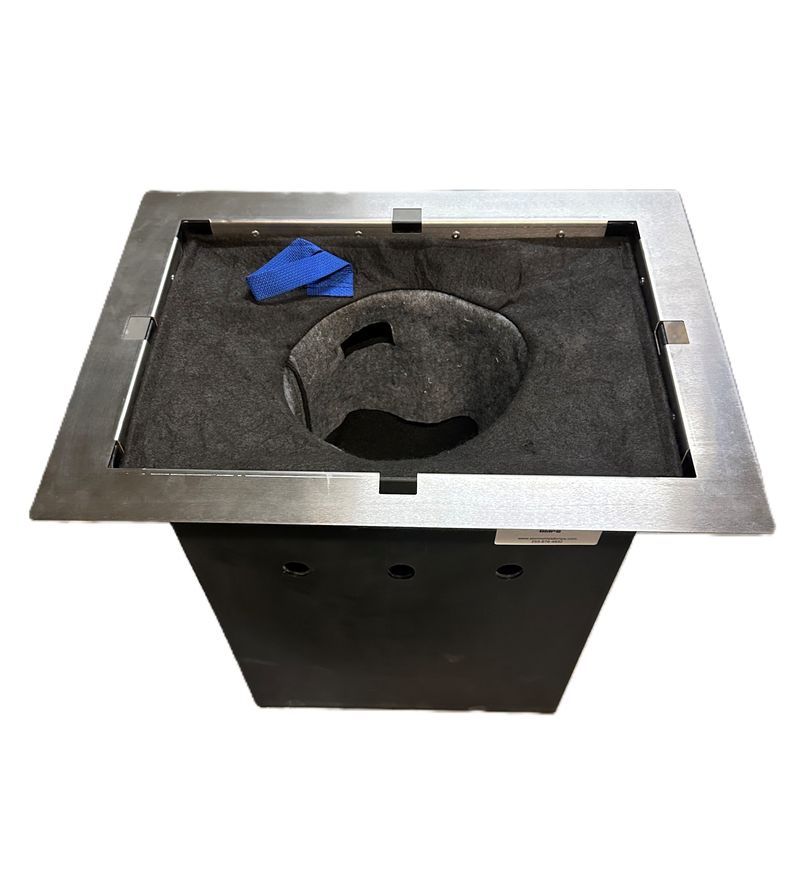 Rectangular metal frame with a dark hole in the center, surrounded by black fabric; blue cloth inside.