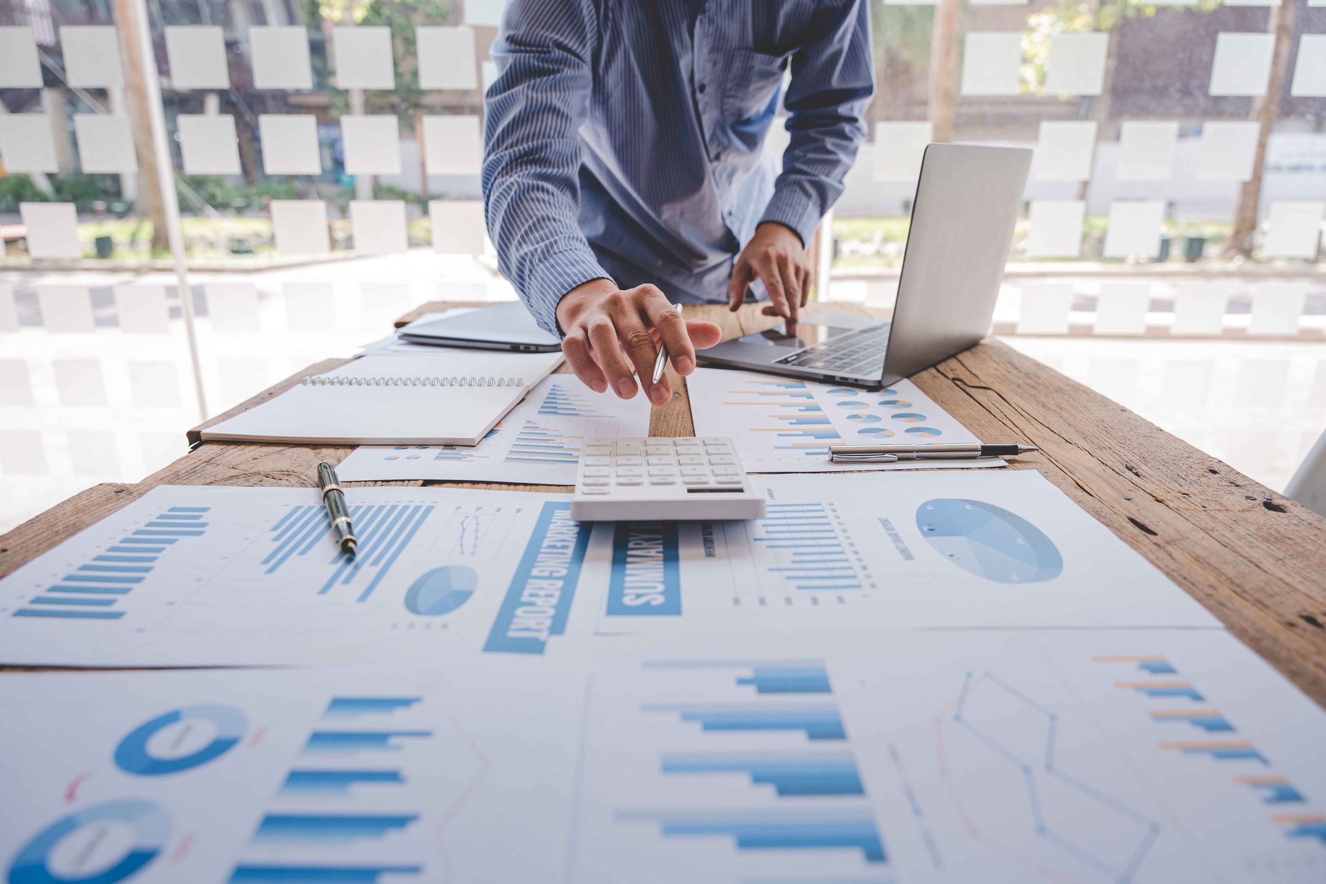 A businessman calculating the taxes of a business.