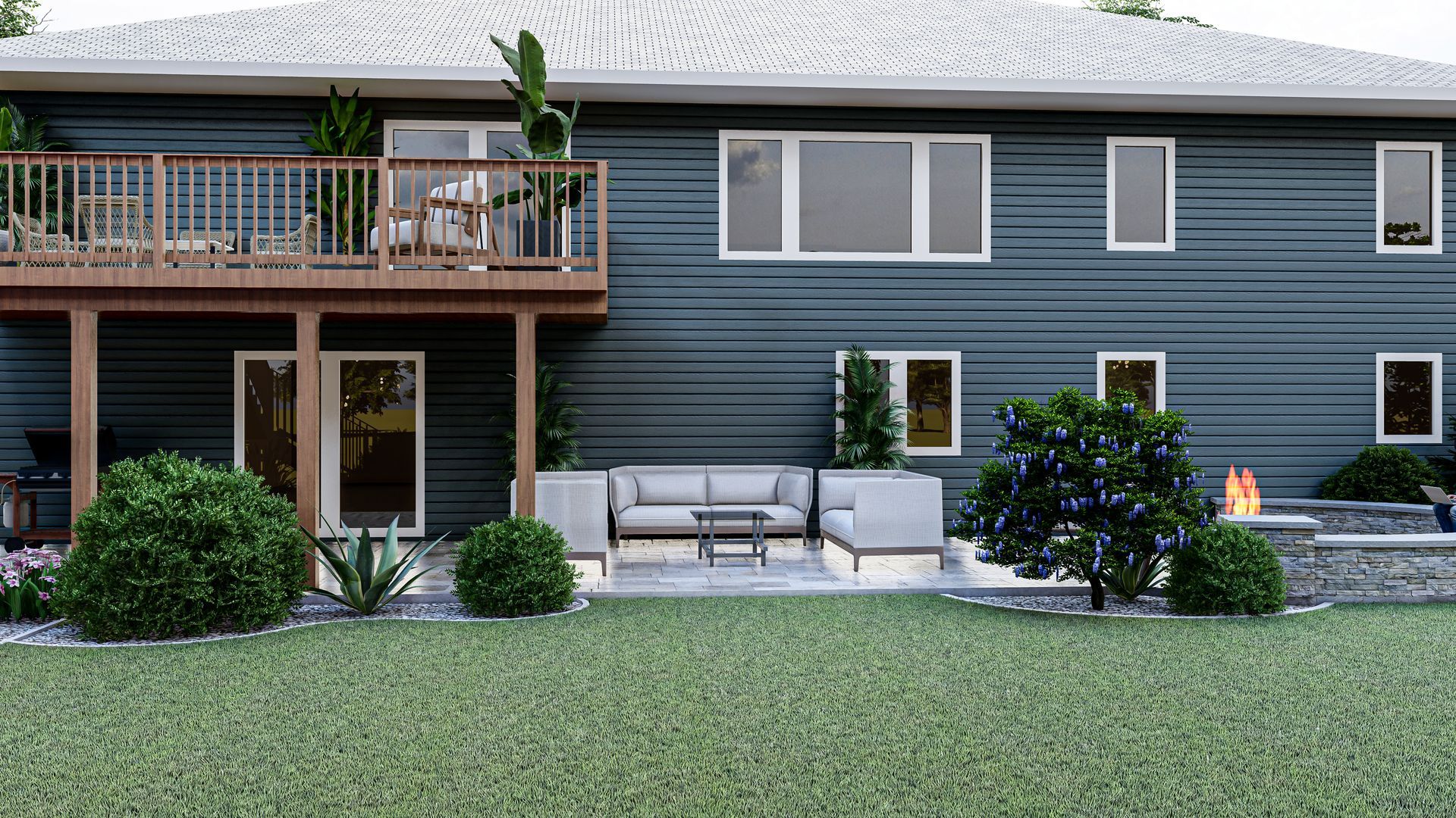 Vue arrière d'une maison bleue à deux étages avec une terrasse en bois, un patio avec des sièges extérieurs modernes et un foyer.