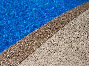 a close up of a swimming pool with epoxy flake system