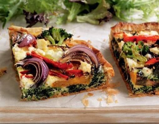 Two Slices of Vegetable Quiche on a Wooden Cutting Board — The Larder Byron Bay in Byron Bay, NSW