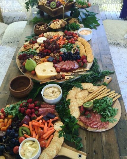 A Wooden Table Topped With a Variety of Fruits and Vegetables — The Larder Byron Bay in Byron Bay, NSW