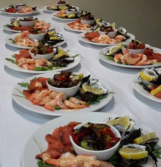 A long row of plates of food on a table