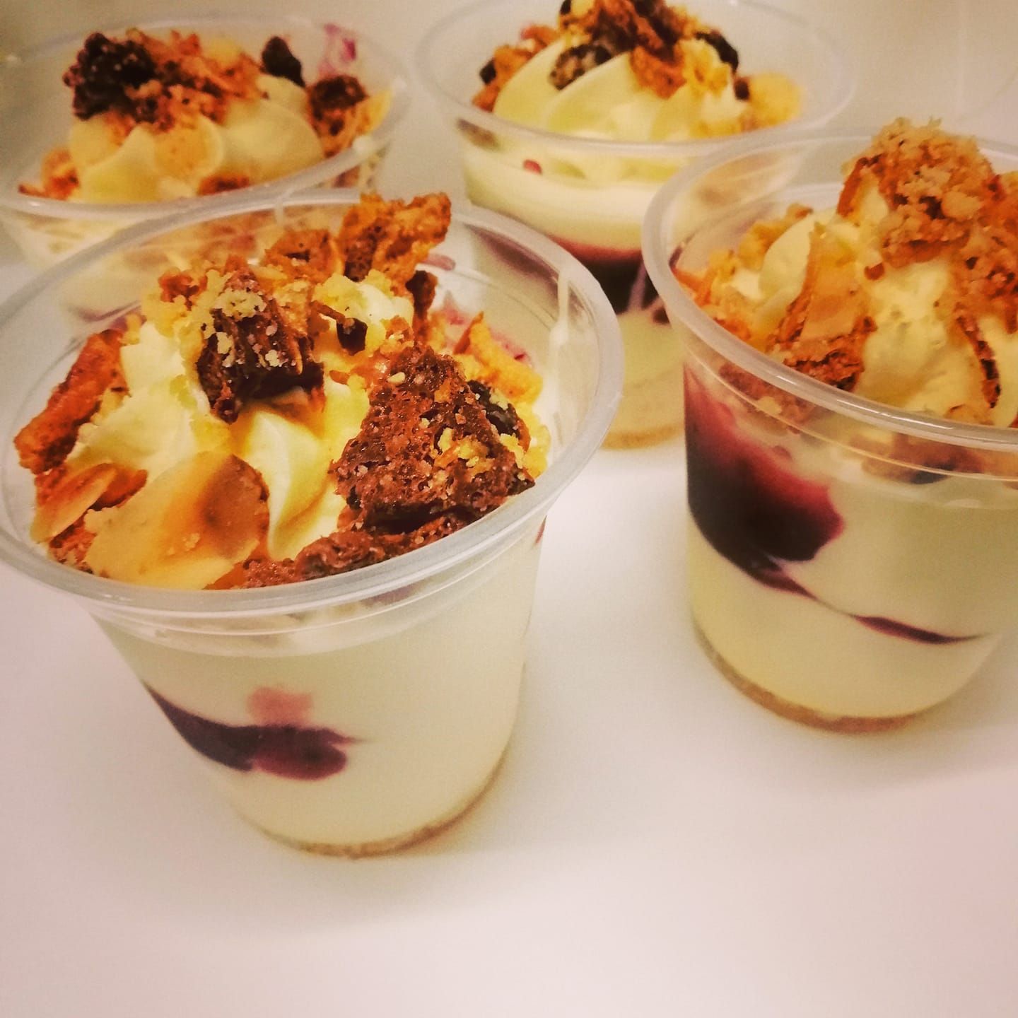 Four Cups of Ice Cream With Toppings on a Table — The Larder Byron Bay in Byron Bay, NSW