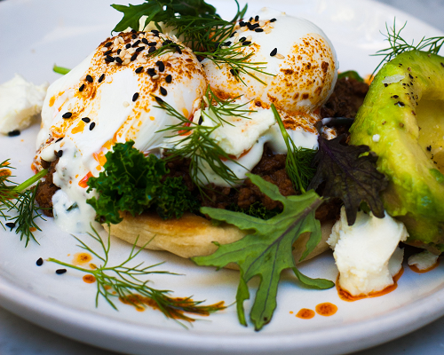 A Close Up of a Plate of Food With Eggs and Avocado — The Larder Byron Bay in Byron Bay, NSW