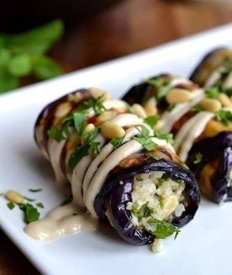 A White Plate Topped With Stuffed Eggplant Rolls — The Larder Byron Bay in Byron Bay, NSW