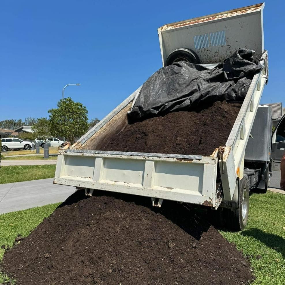 Tipper Truck Loaded With Soil On A Sunny Day — Port Tipper & Driver In Port Macquarie, NSW