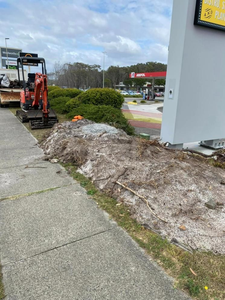 Small Excavator And Dirt On The Sidewalk — Port Tipper & Driver In Port Macquarie, NSW