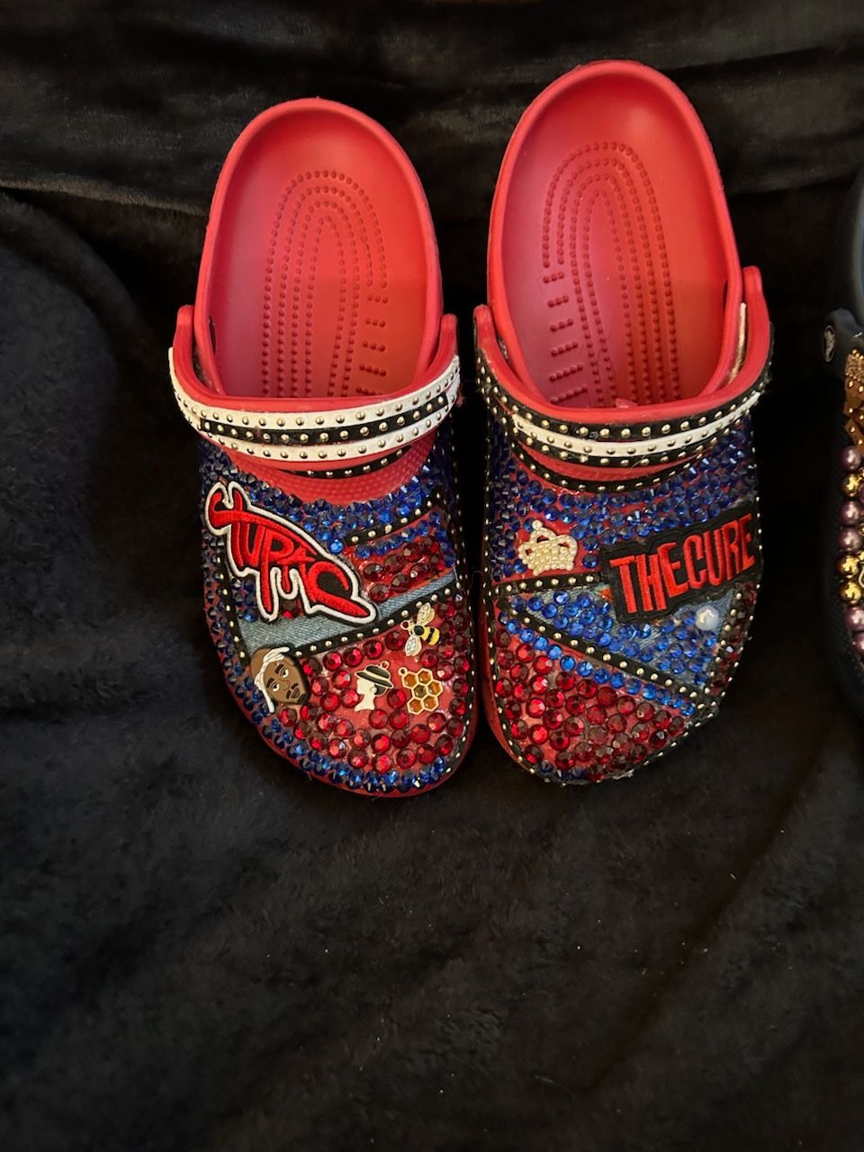 Bedazzled red and blue Crocs with