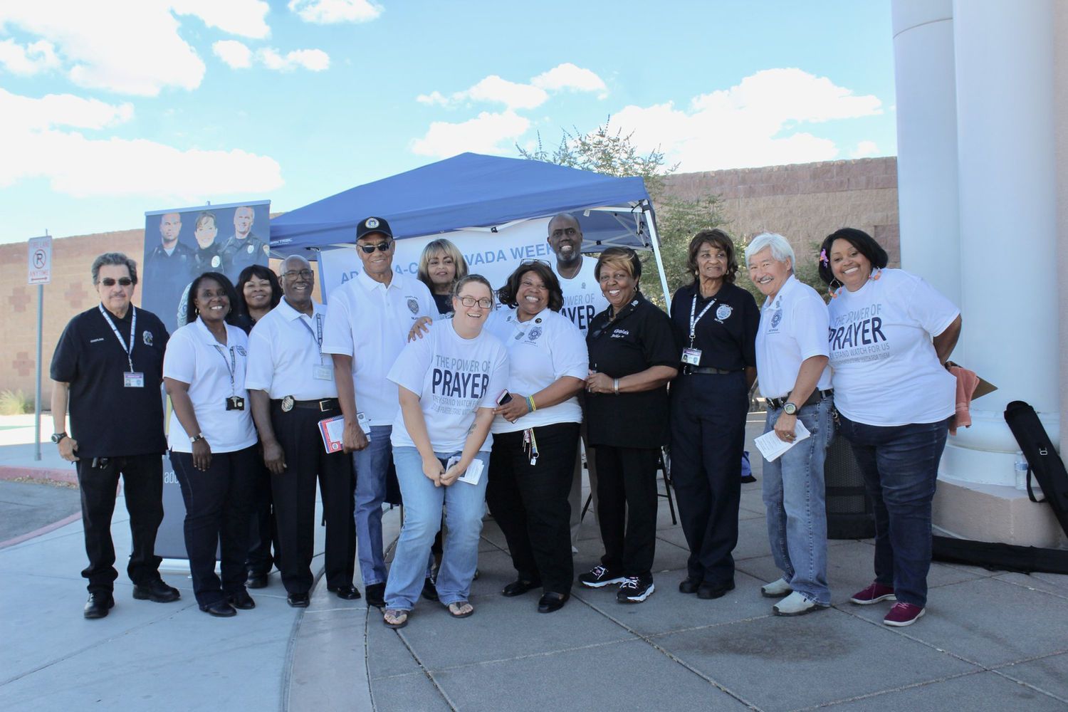 Group of people at an outdoor event, some wearing