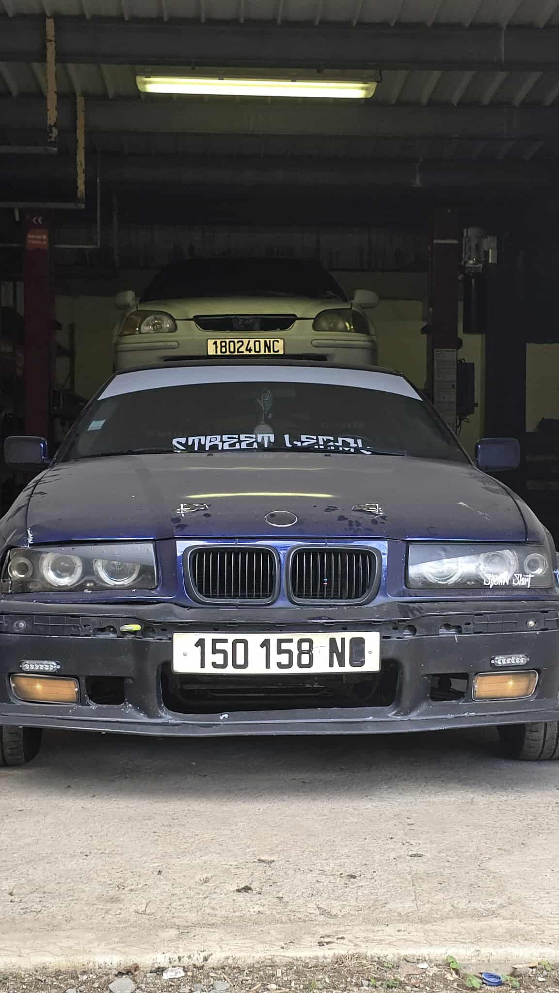 Dark blue BMW, license plate 