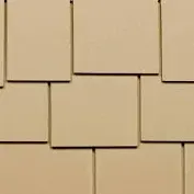 A close up of a tan roof tile.