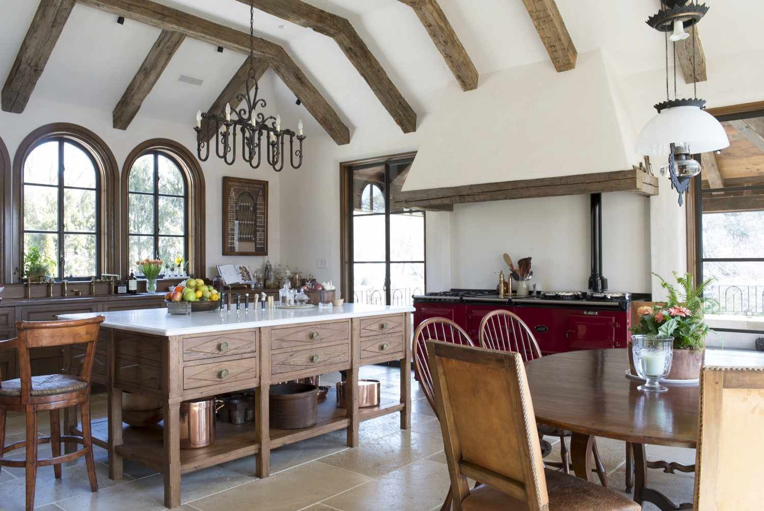 A kitchen with a table and chairs in it