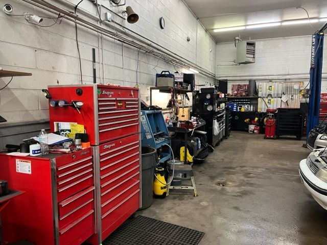 A garage with a lot of tools and a red toolbox.