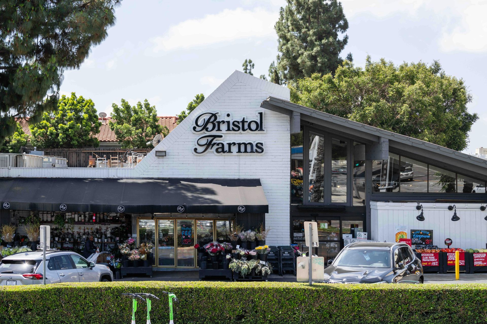 A close up of the ceiling of a garage with two electrical outlets.