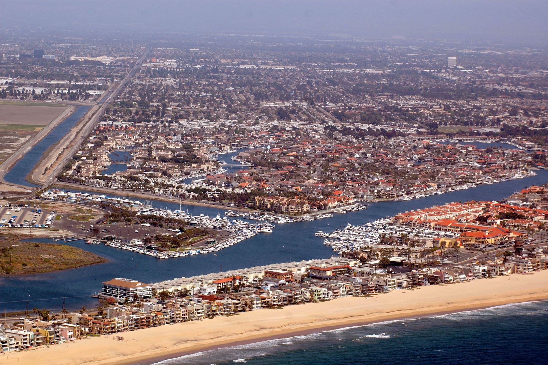 An aerial view of a city and a body of water, Photograph by Don Ramey Logan