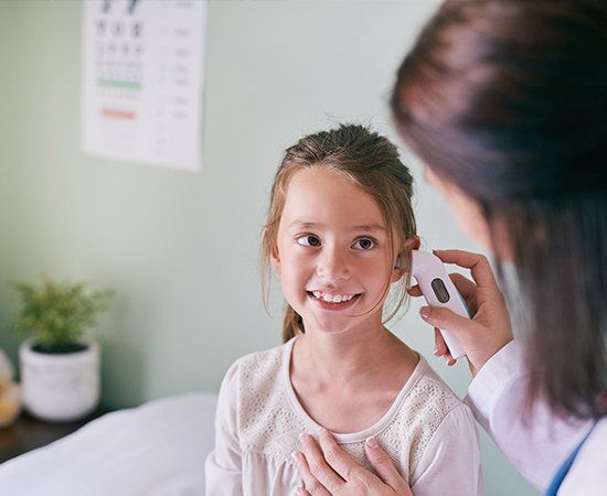 Doctor Examining Girl Ears — Tucson, AZ — Southwest Hearing Care Inc.