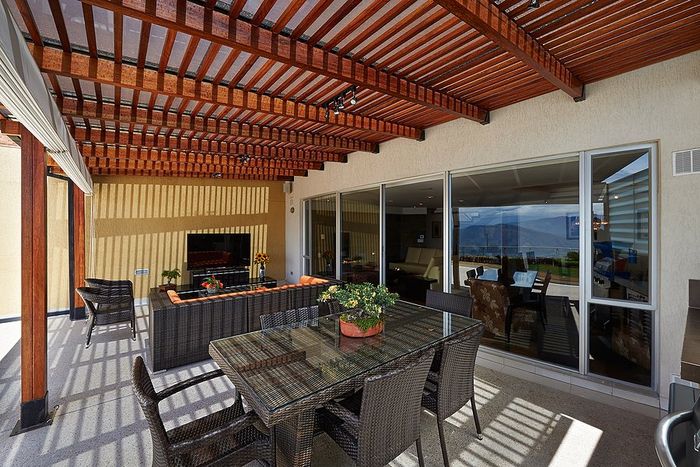 a hotel deck with pergola