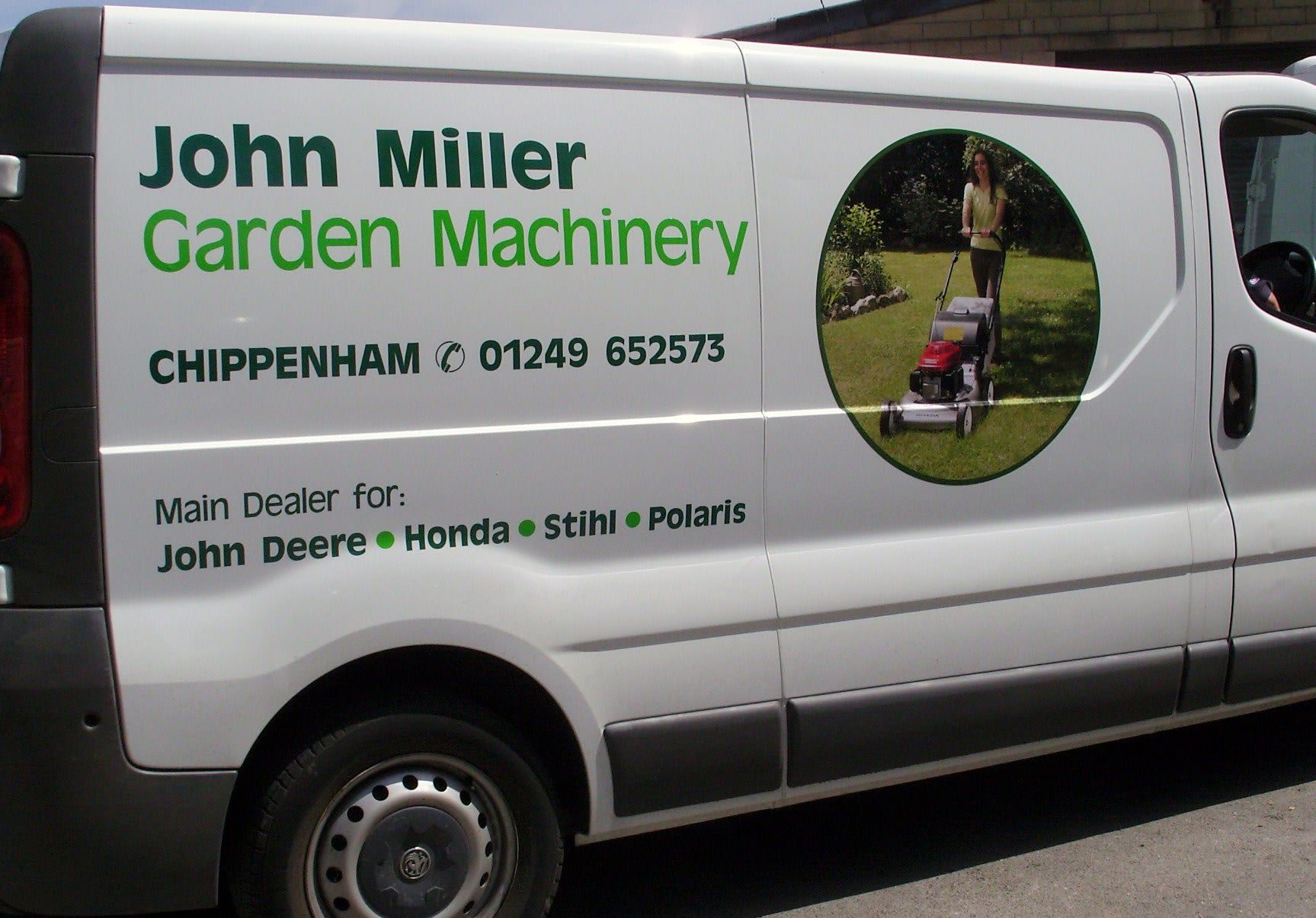 white van with vehicle livery