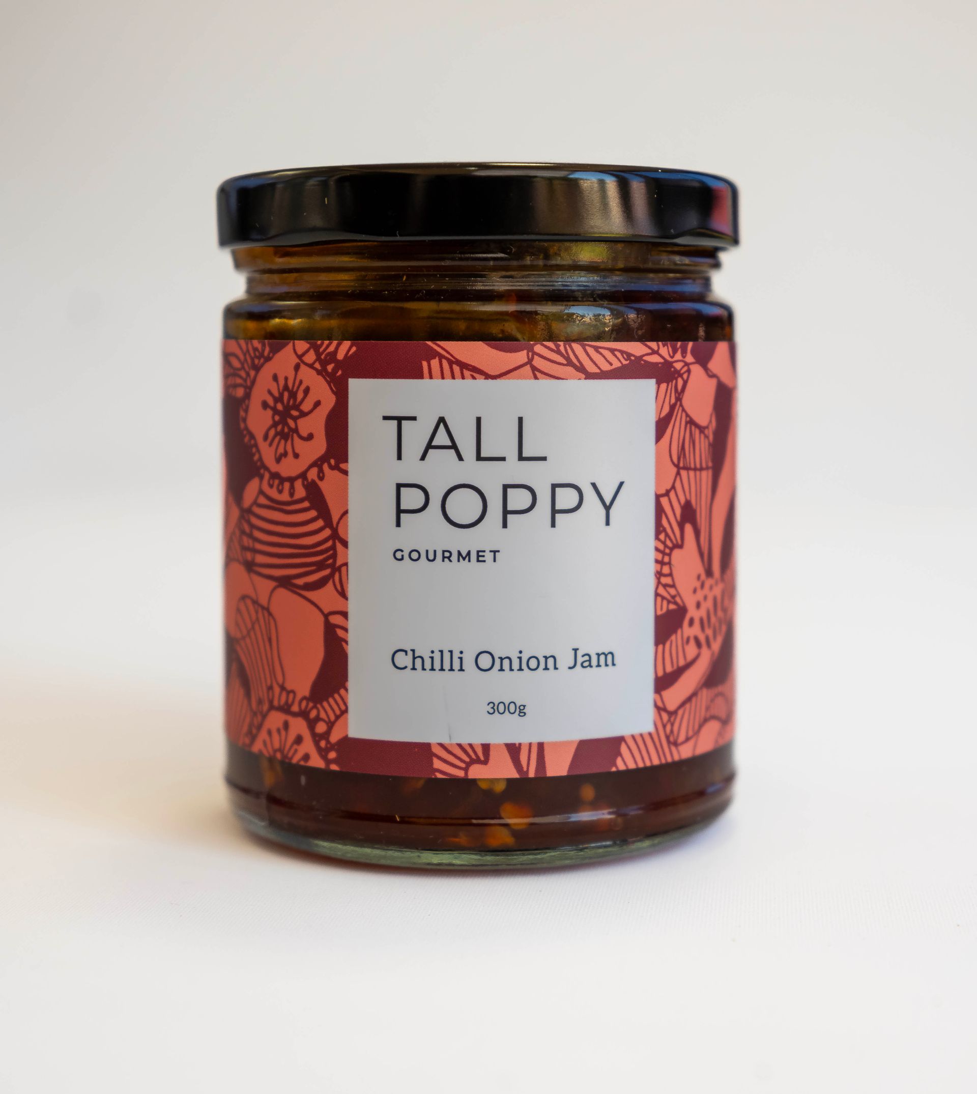 Jar of Tall Poppy Chilli Onion Jam with red label.