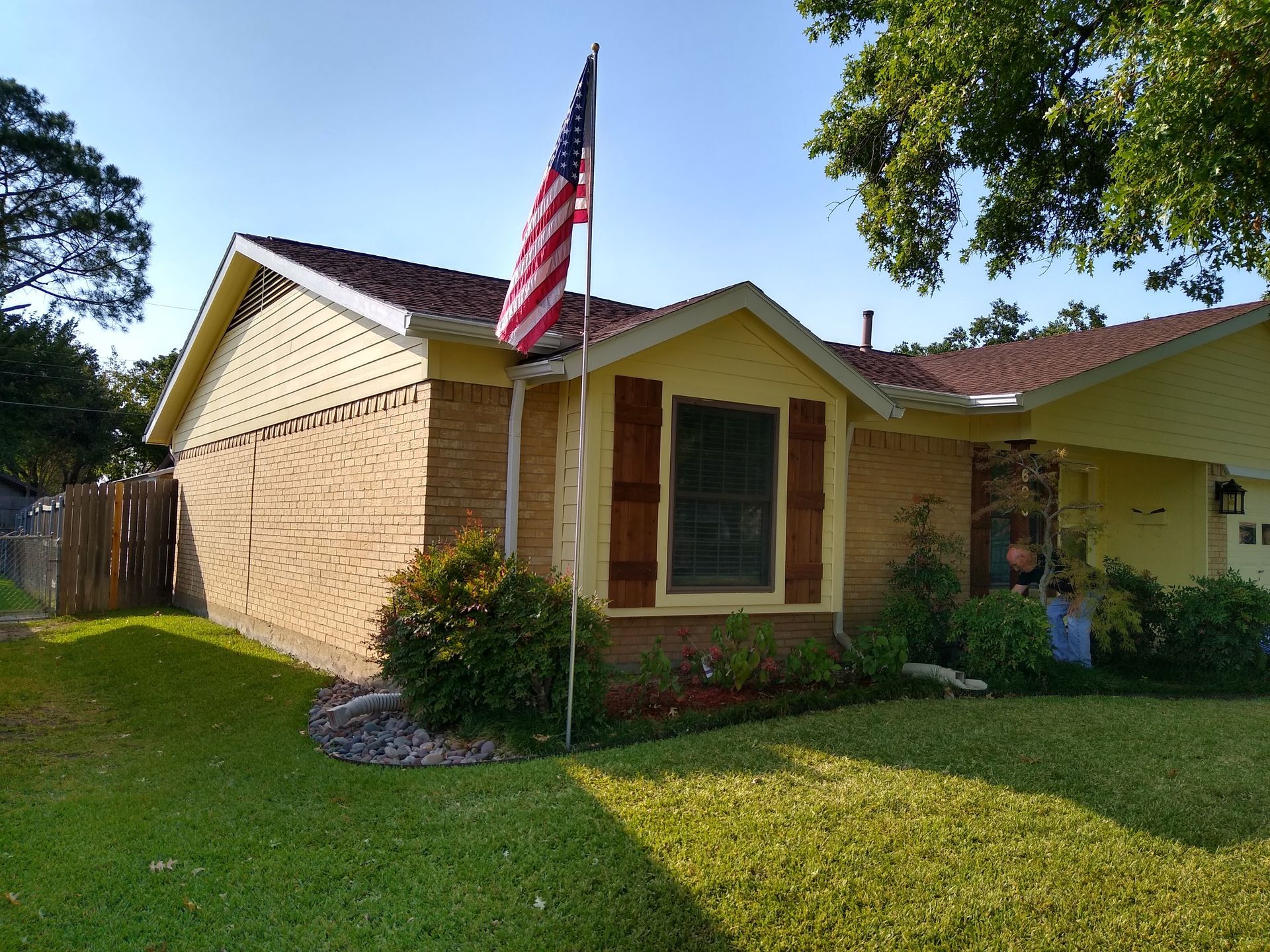 A house with an american flag flying in front of it.