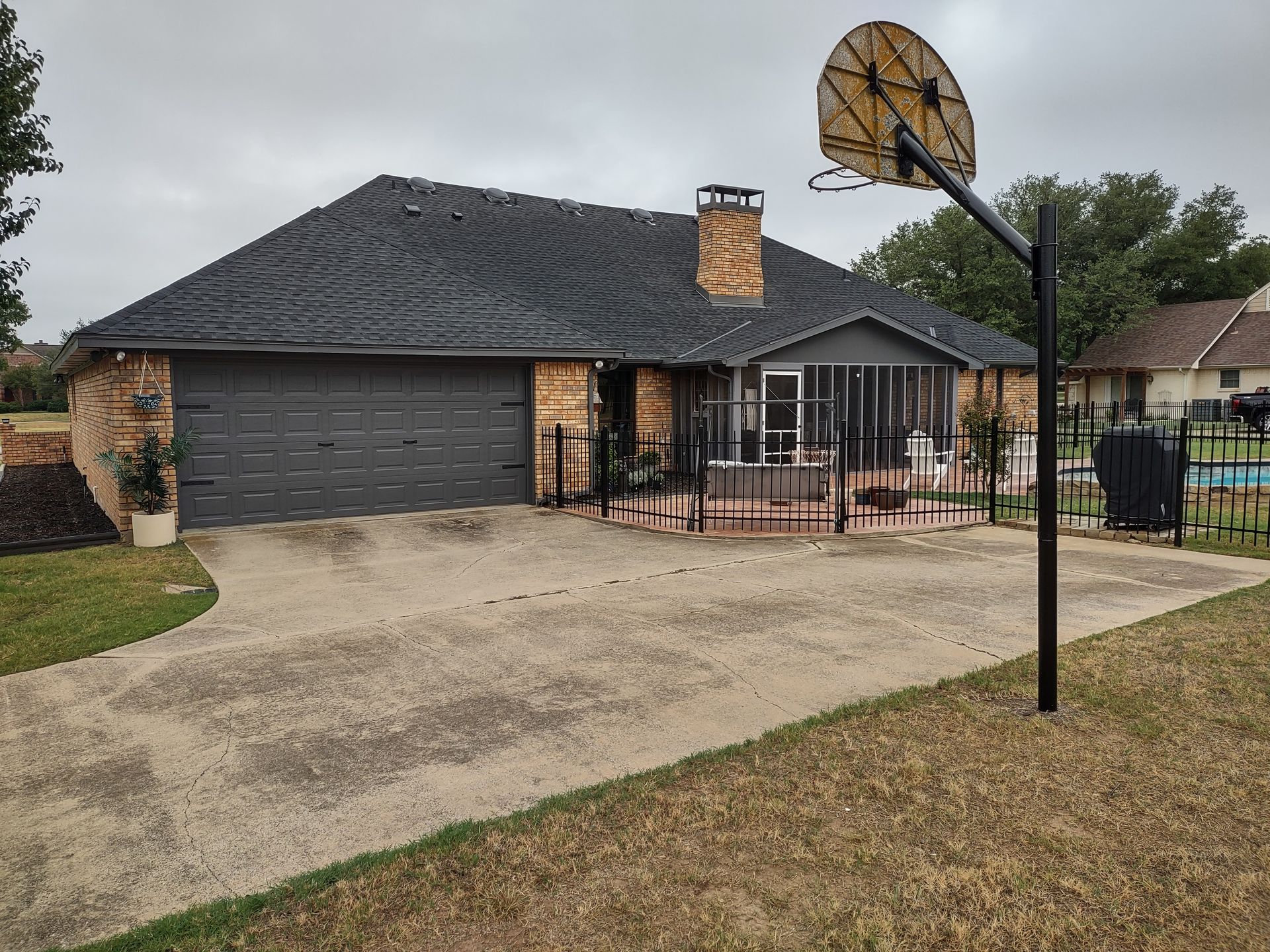 A house with a basketball hoop in front of it