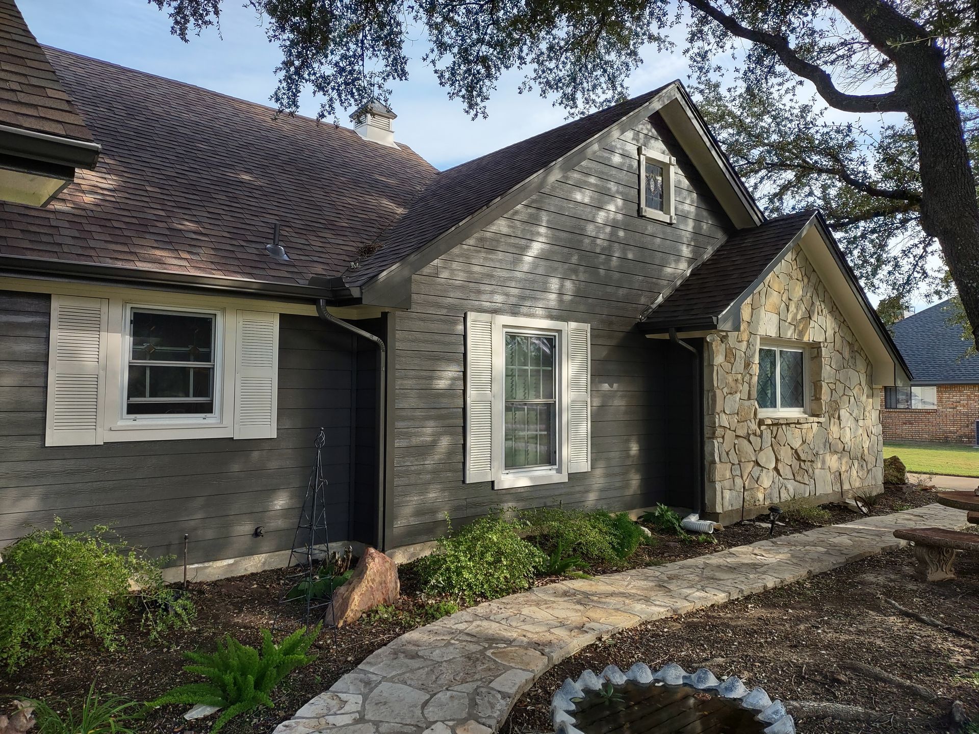 A house with a stone walkway leading to it