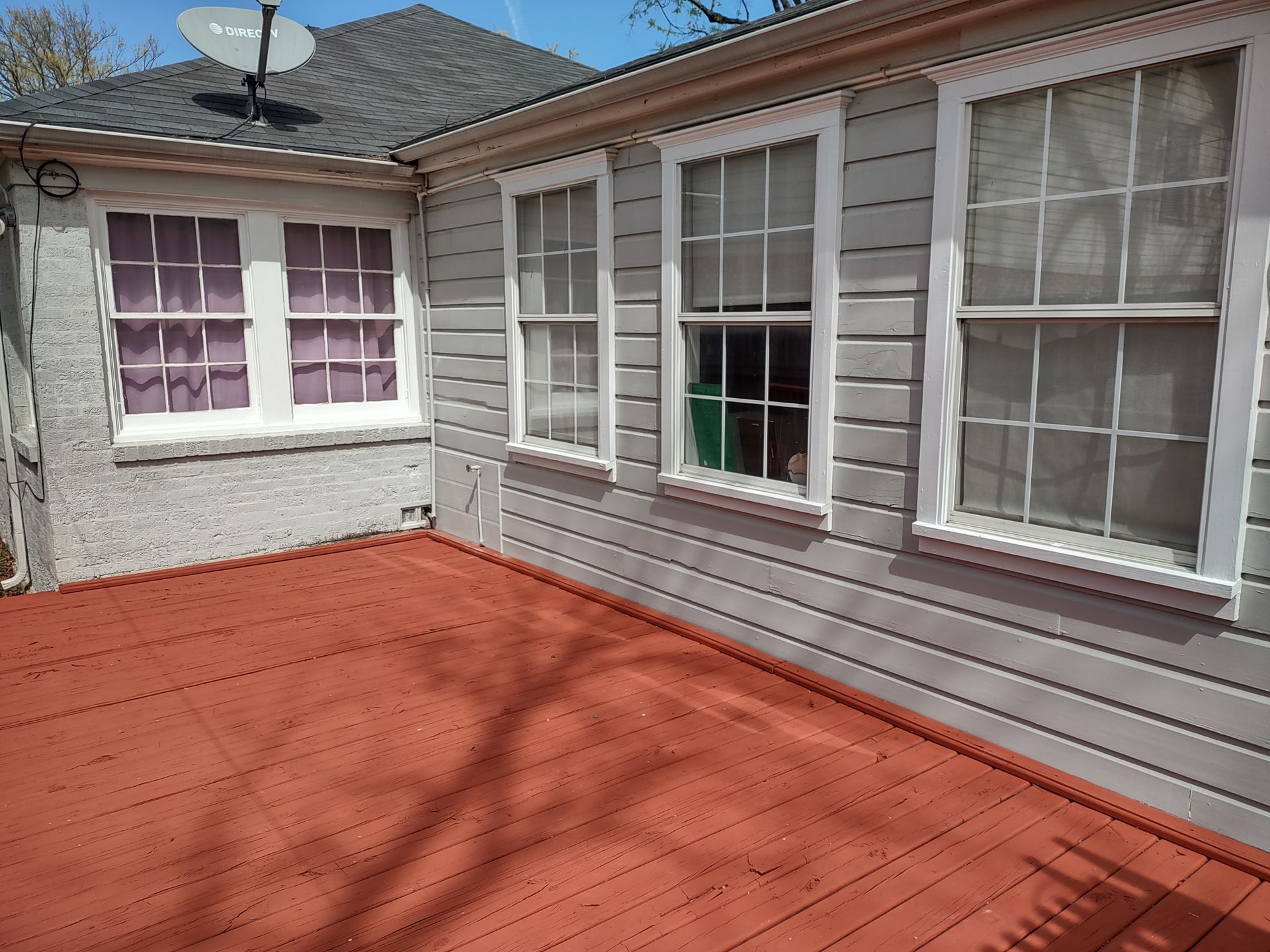 A house with a satellite dish on top of it