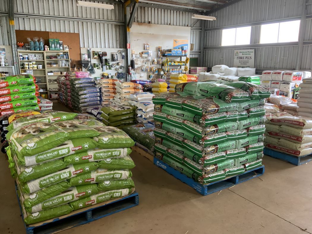 A Warehouse Filled With Lots of Bags of Feeds — Barnyard Stockfeed, Pet, Garden and Florist in Childers, QLD