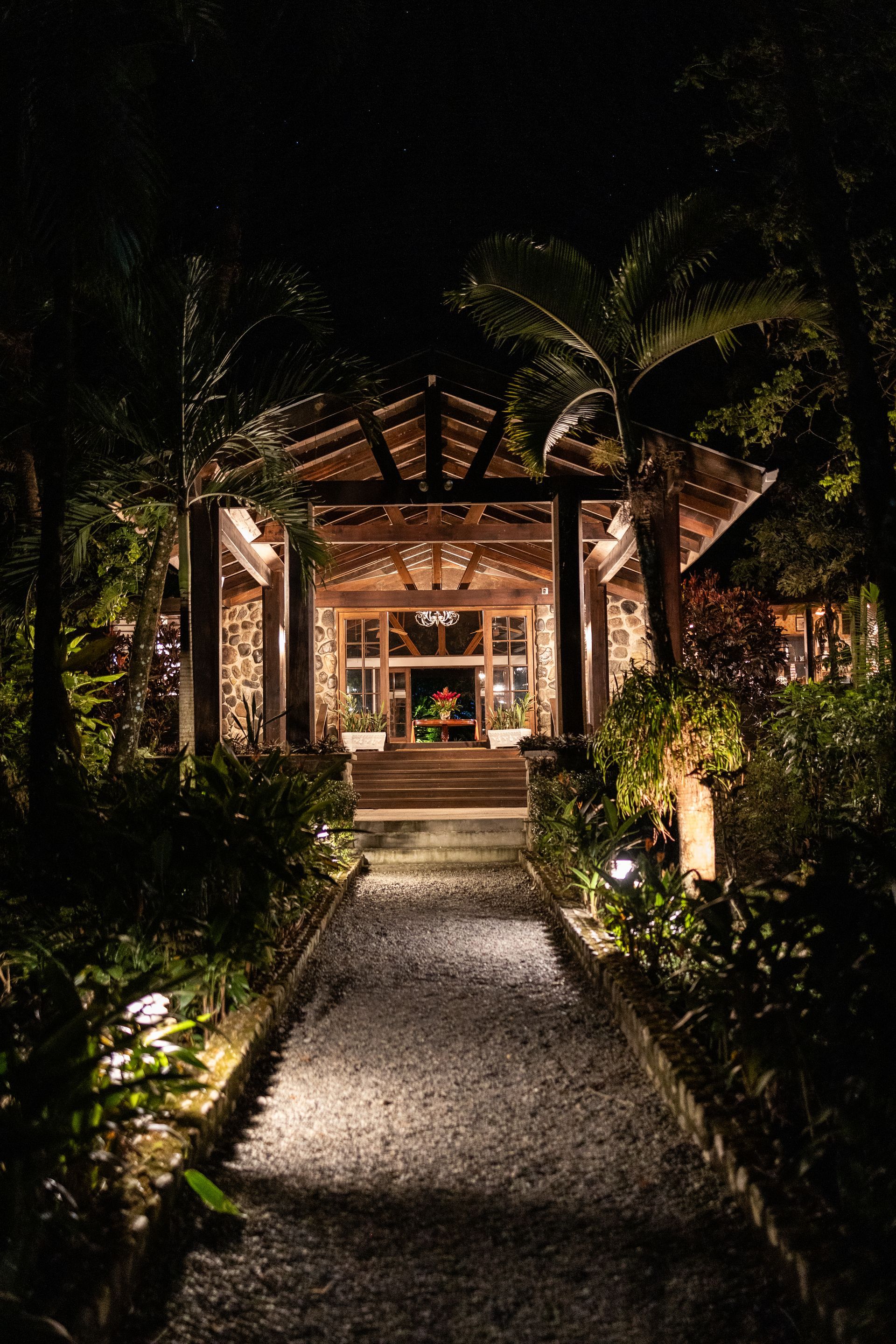 The entrance to a building is lit up at night.