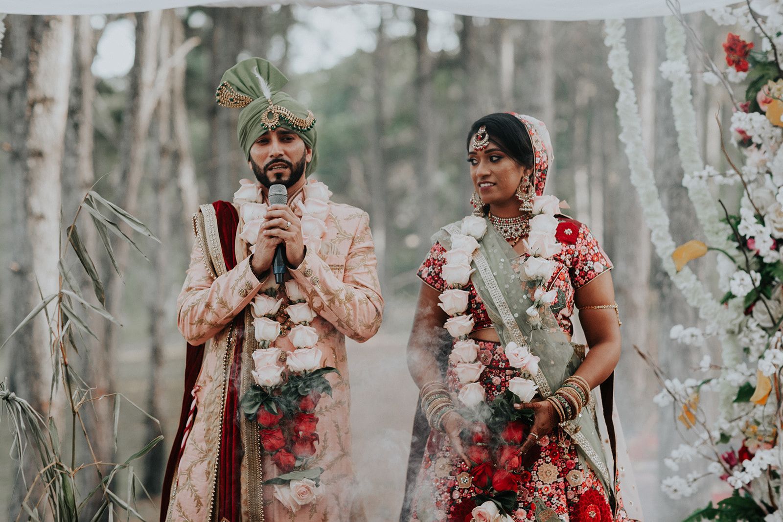 A bride and groom are standing next to each other at their wedding ceremony.