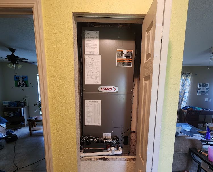 An air conditioner is installed in a closet in a house.