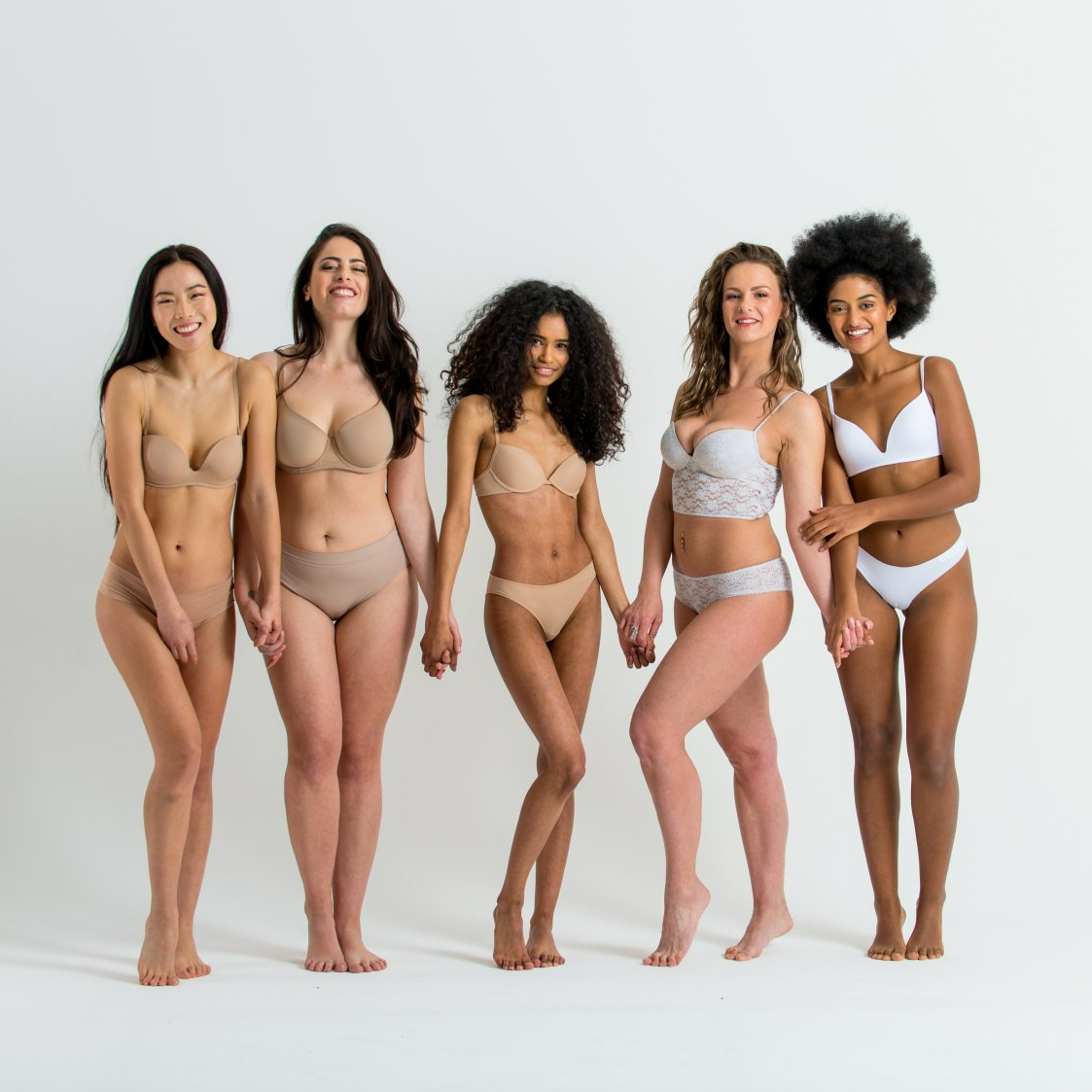 a group of women with diverse body types