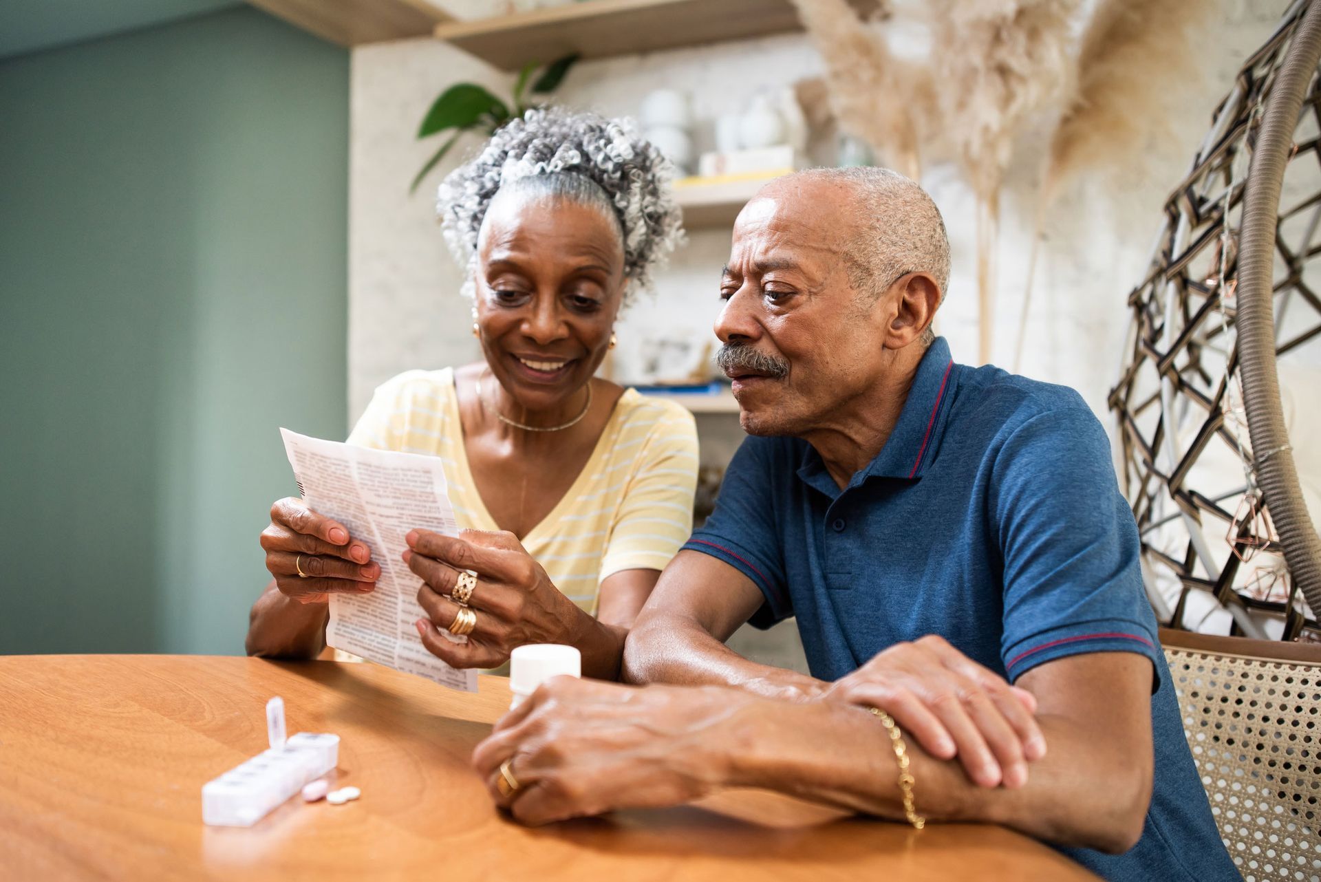 Old Couple Checking A Prescription — Pensacola, FL — Integrity Financial Group