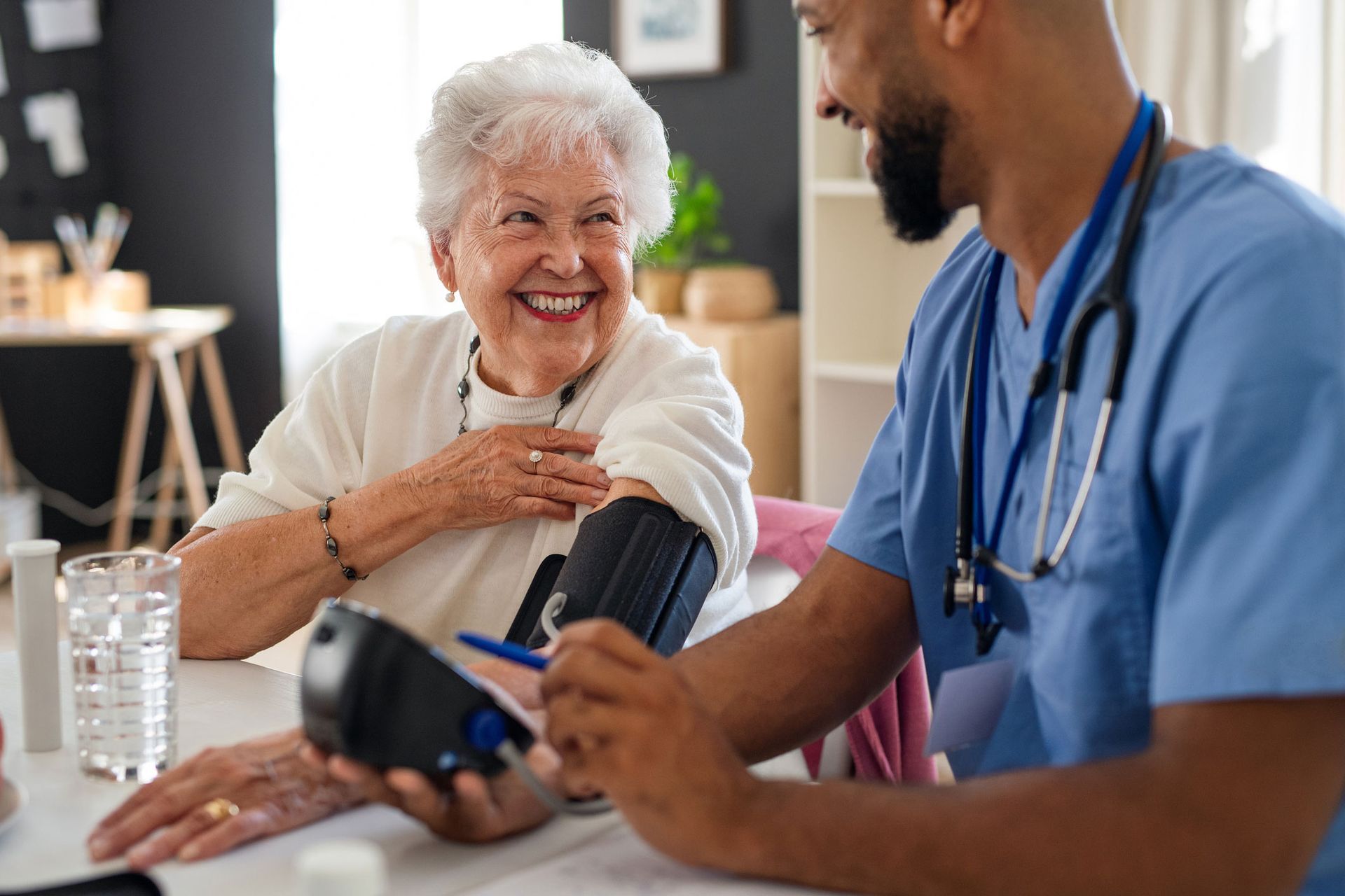 Old Woman Taking Blood Pressure Test — Pensacola, FL — Integrity Financial Group