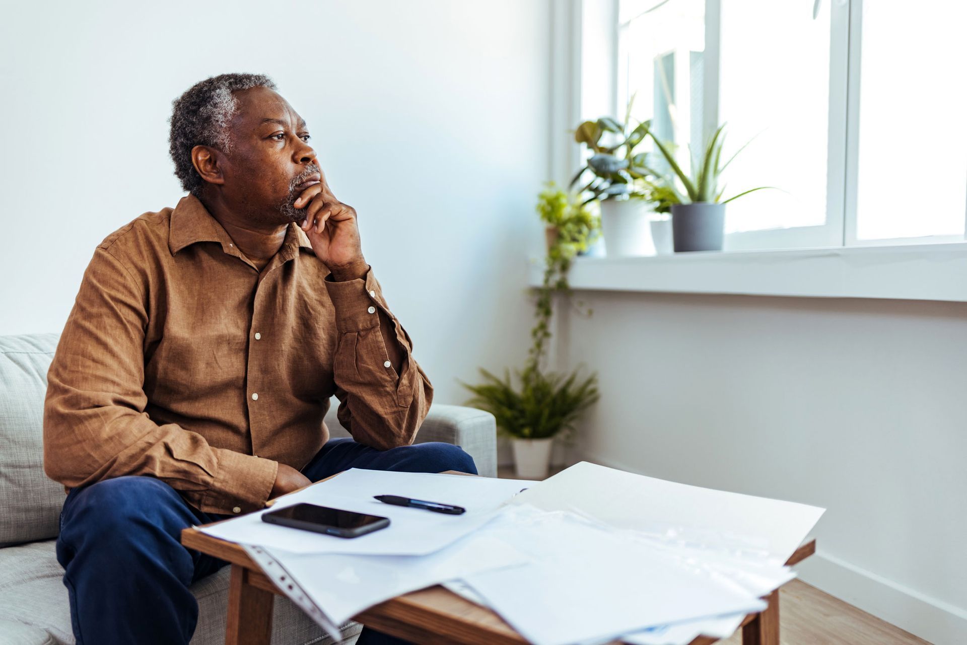 Old Man Looking At A Window — Pensacola, FL — Integrity Financial Group