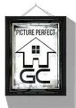 Black framed sign with "Picture Perfect" text and a house logo with "HGC" below.
