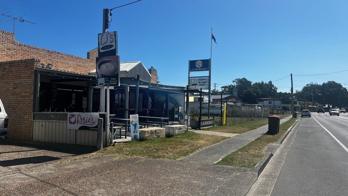A Restaurant Is Sitting On The Side Of The Road Next To A Road — Tanilba Bay Laundromat In Tanilba Bay, NSW