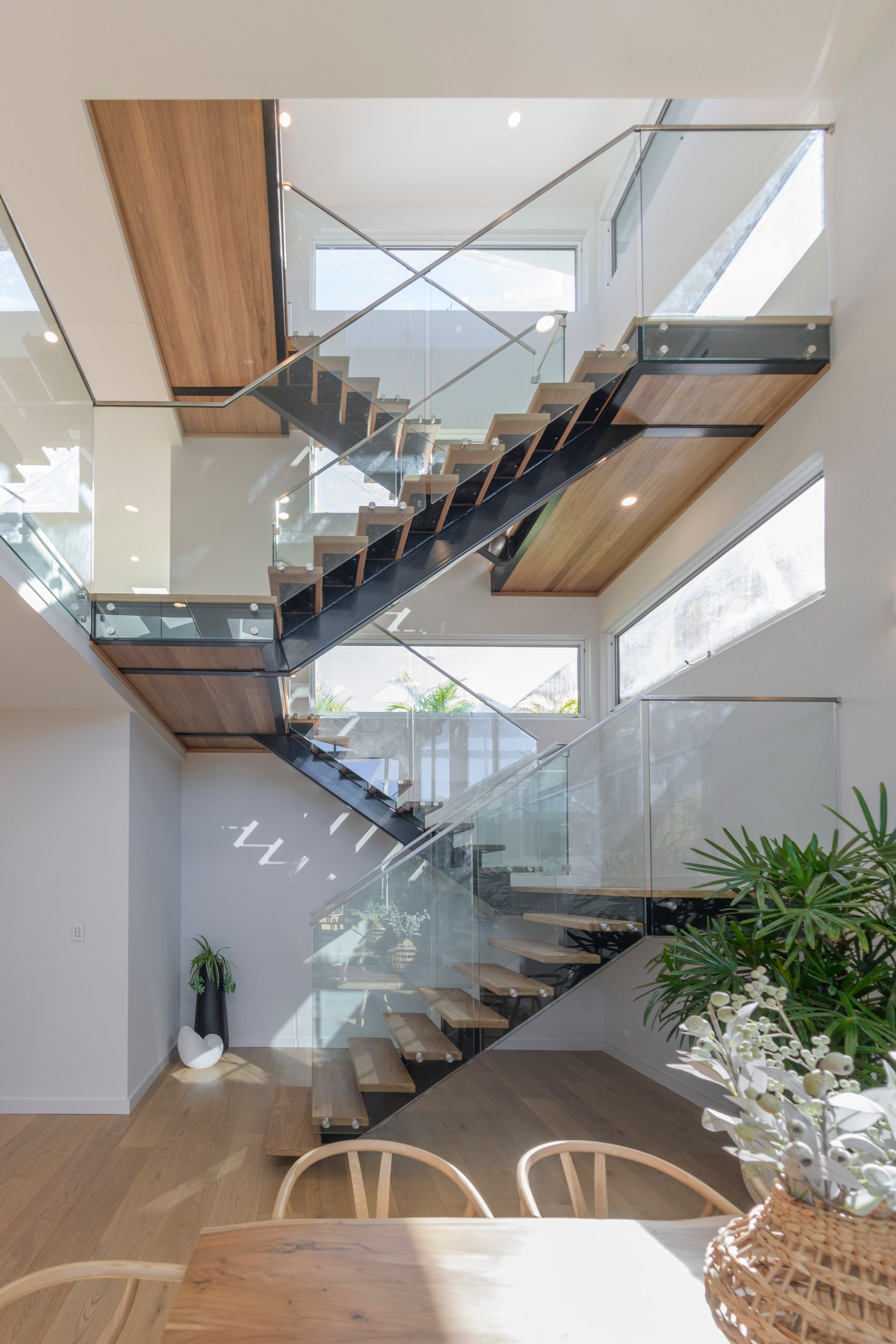 Wooden and Glass Floating Staircase in a Bright, Modern Home With Natural Light — Indie Living In Lake Macquarie, NSW